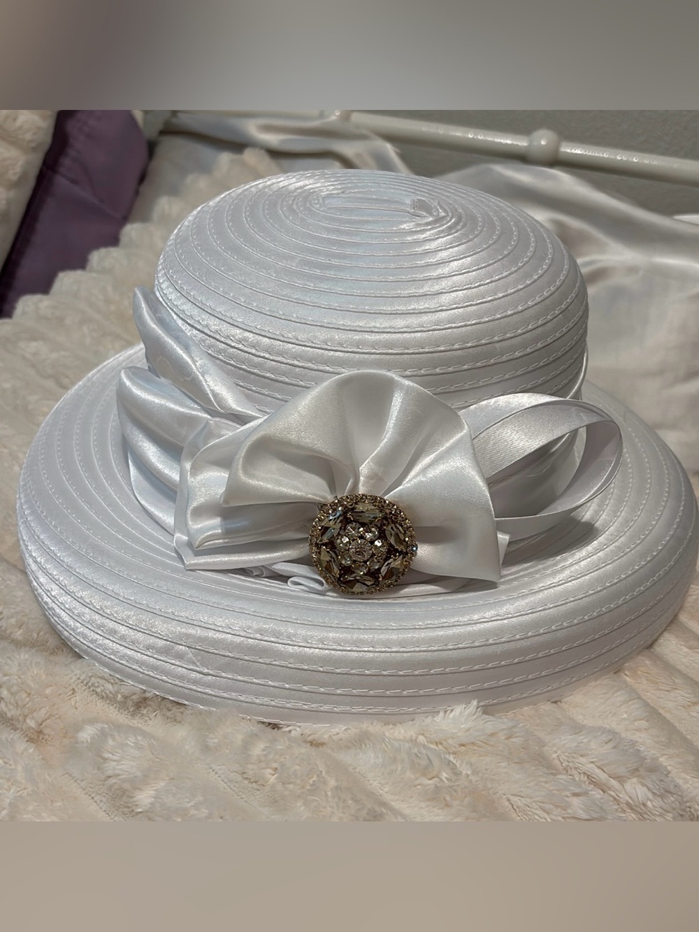 Elegant White Hat with Gold Brooch